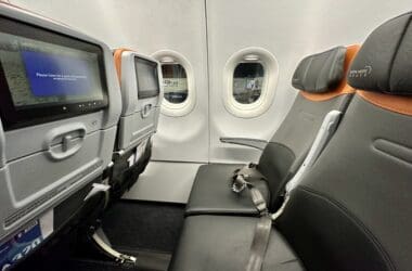 seats in an airplane with windows and seats