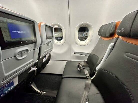 seats in an airplane with windows and seats