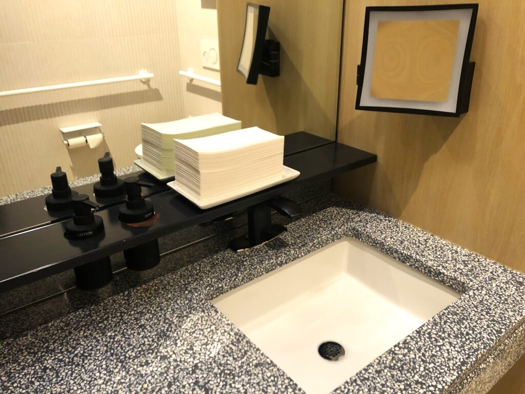 a sink and a mirror in a bathroom