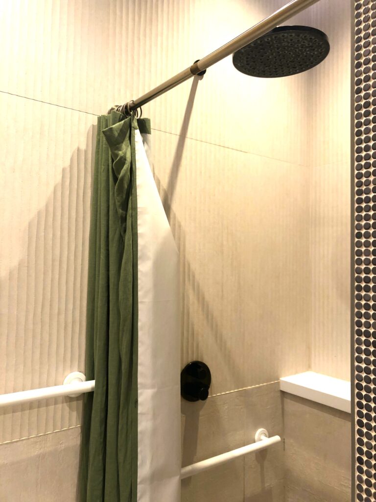 a shower curtain and a shower head