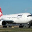 a large white airplane on a runway