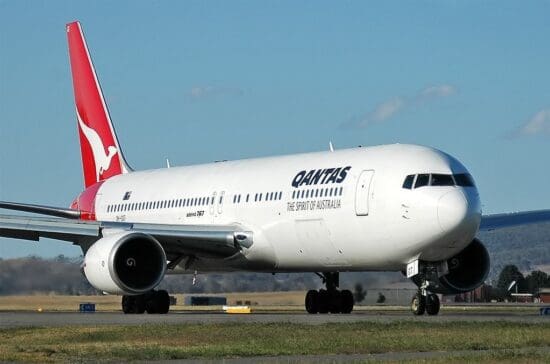 a large white airplane on a runway