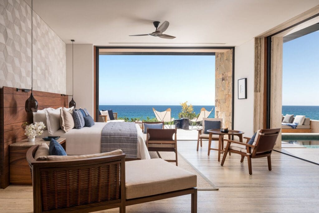 a room with a large window overlooking the ocean