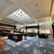 a room with a large ceiling and a group of people