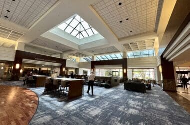 a room with a large ceiling and a group of people