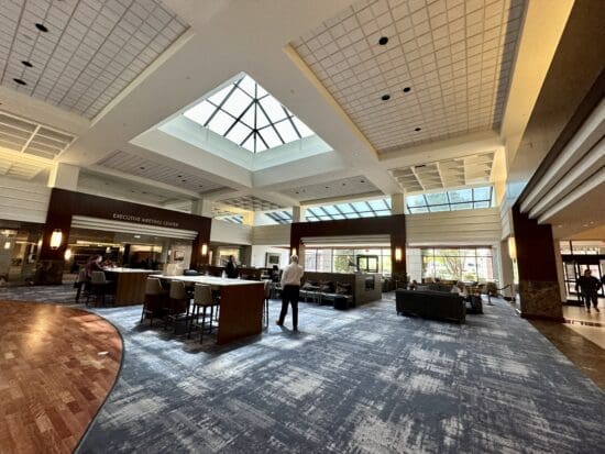 a room with a large ceiling and a group of people