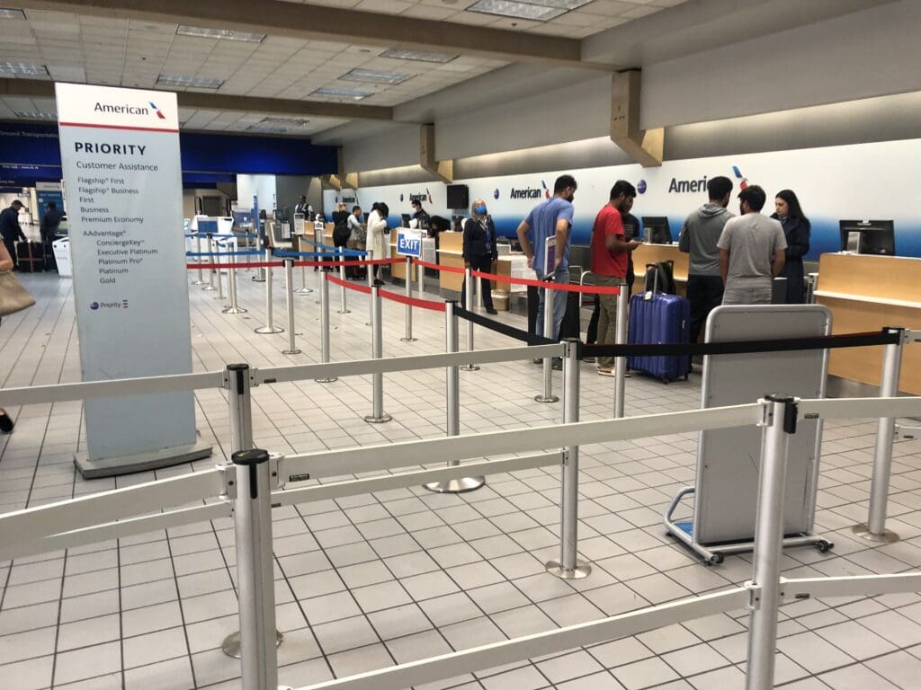 people standing in line at an airport