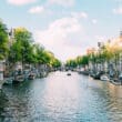 a canal with boats and buildings on the side