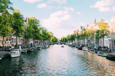 a canal with boats and buildings on the side