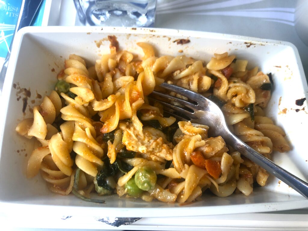 a bowl of pasta with a fork