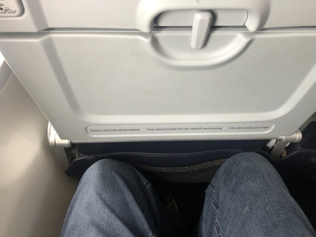 a person's legs in a seat