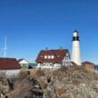 a lighthouse on a rocky hill