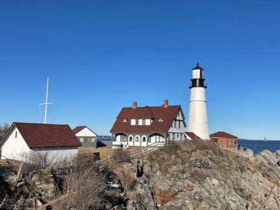 a lighthouse on a rocky hill