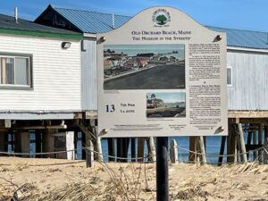 a sign on a beach