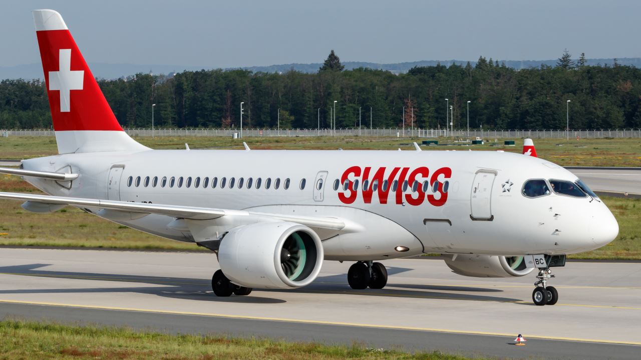 a white airplane on a runway