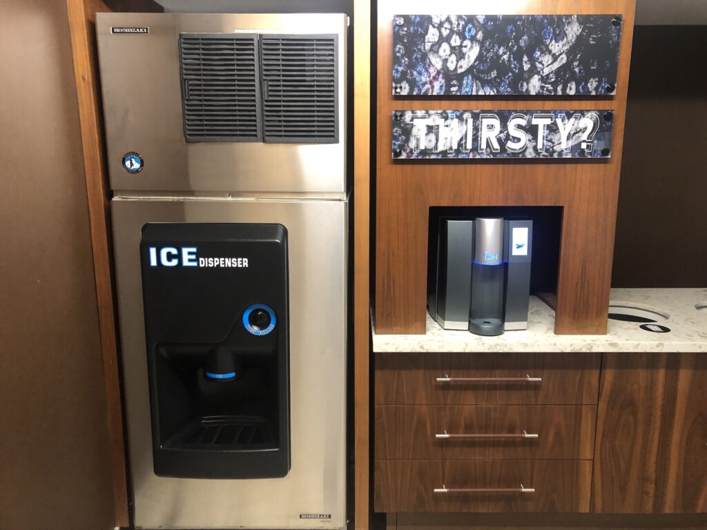 a machine next to a cabinet