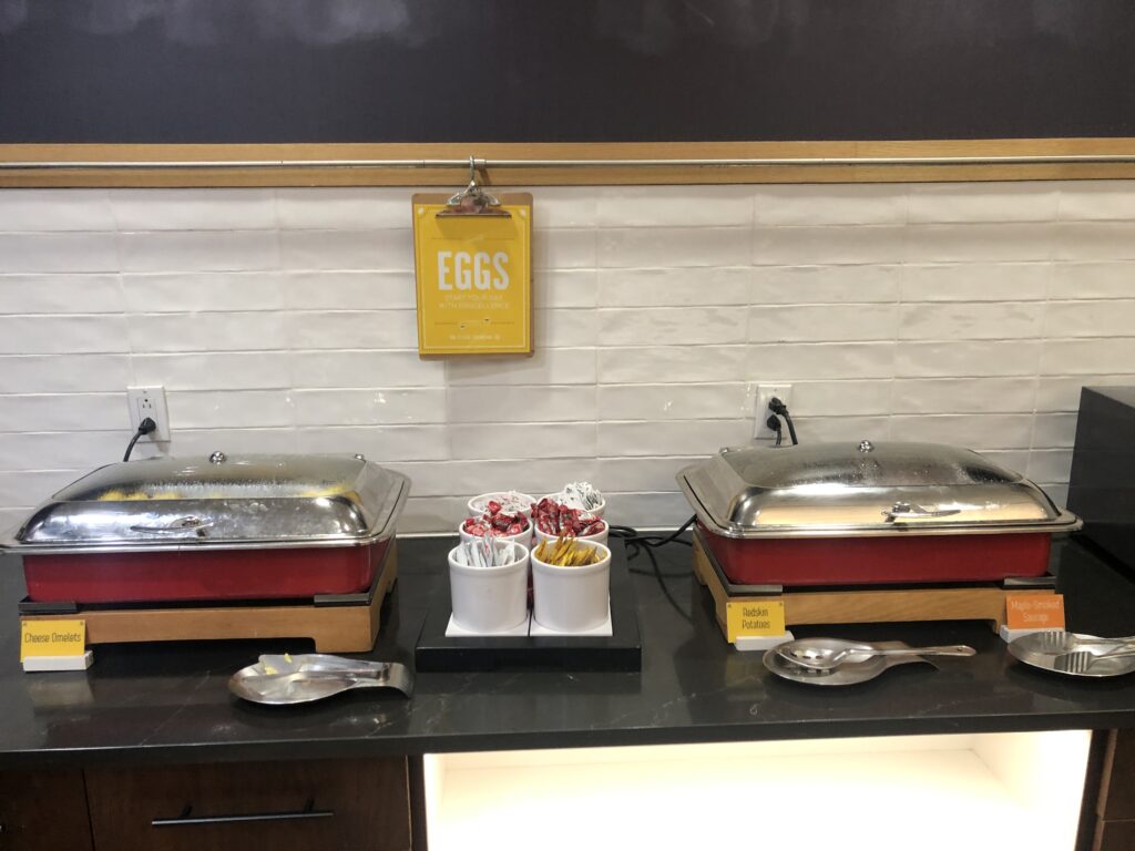 food on a counter with a sign
