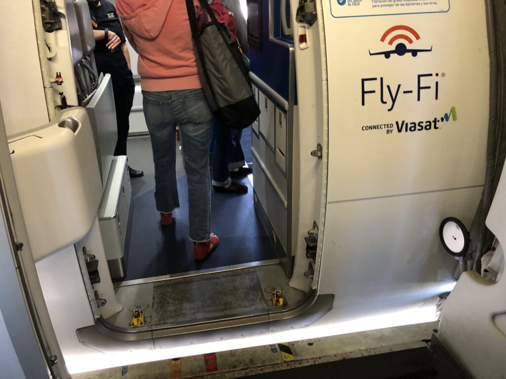 a person walking into an airplane