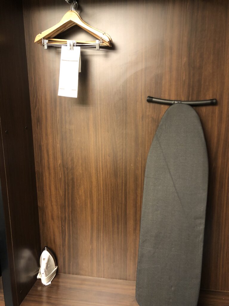 a ironing board on a wooden door
