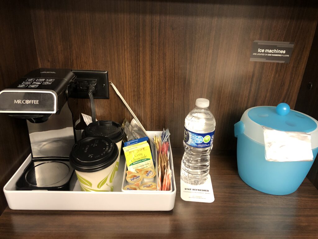 a coffee machine and a bottle of water