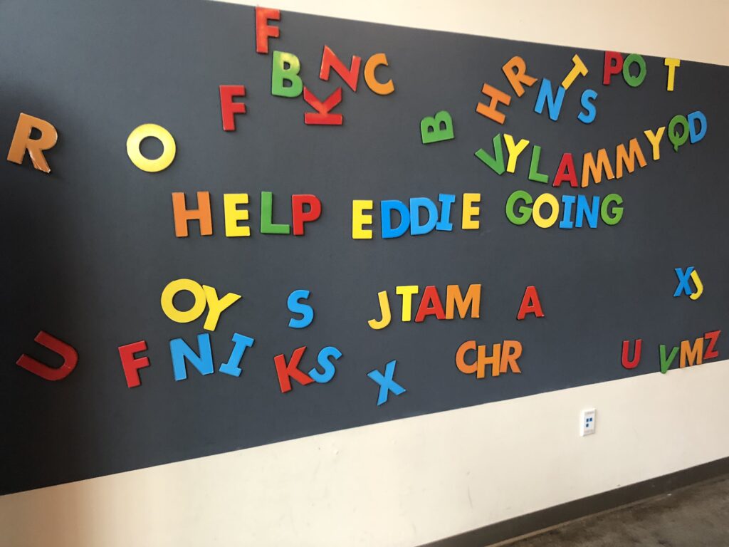 a wall with letters on it