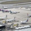 an airport with airplanes parked on the runway