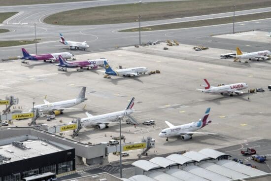 an airport with airplanes parked on the runway