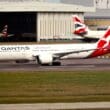 a large white airplane on a runway