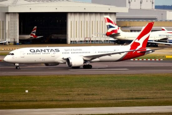 a large white airplane on a runway