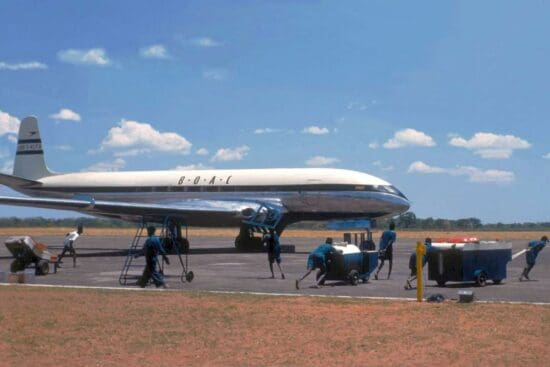 a group of people walking on a runway