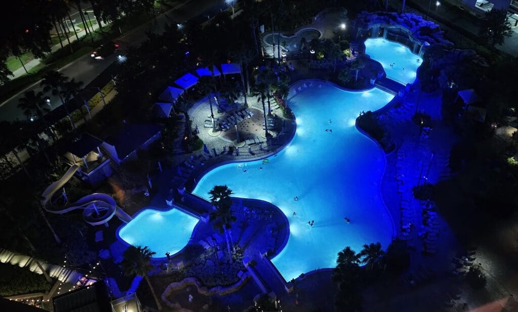 a swimming pool with blue lights at night