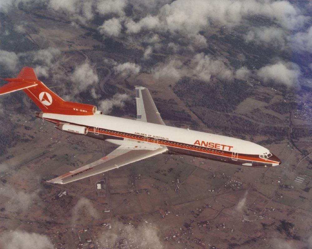 an airplane flying over a city