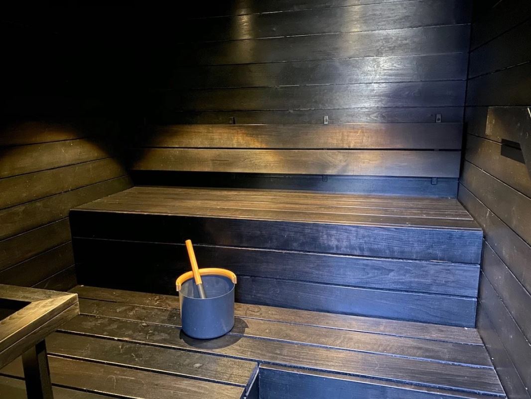 a bucket on a wooden bench