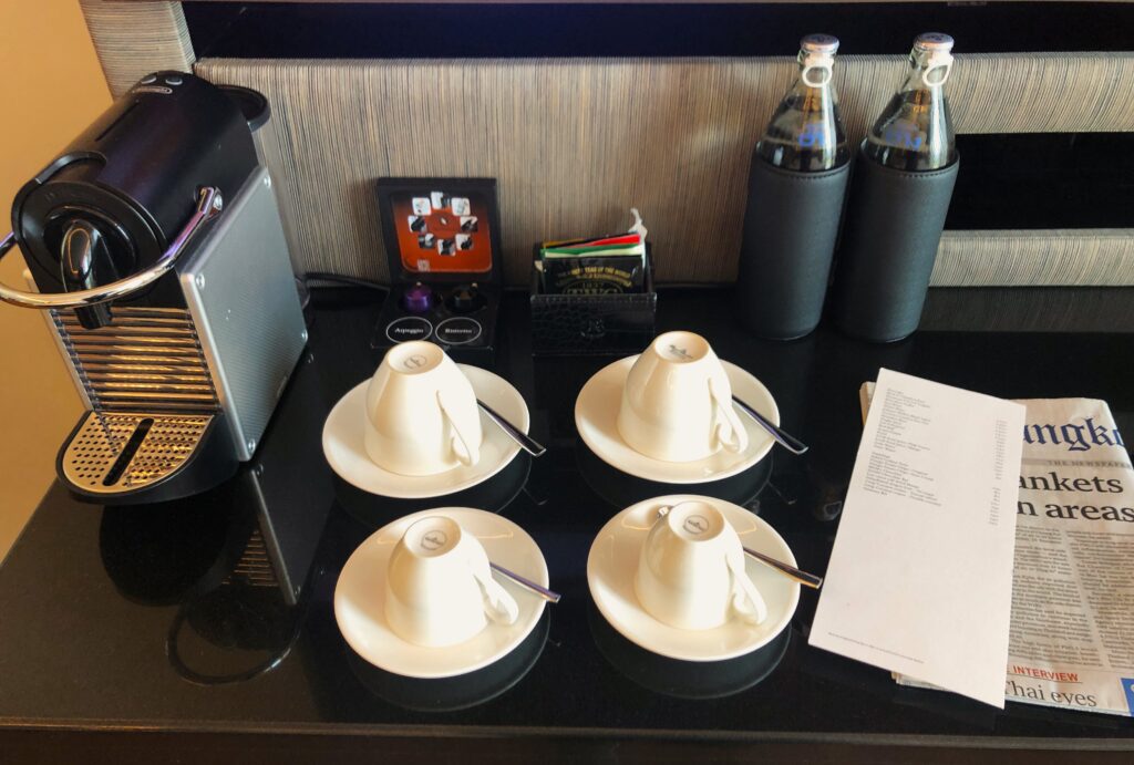 a table with cups and saucers