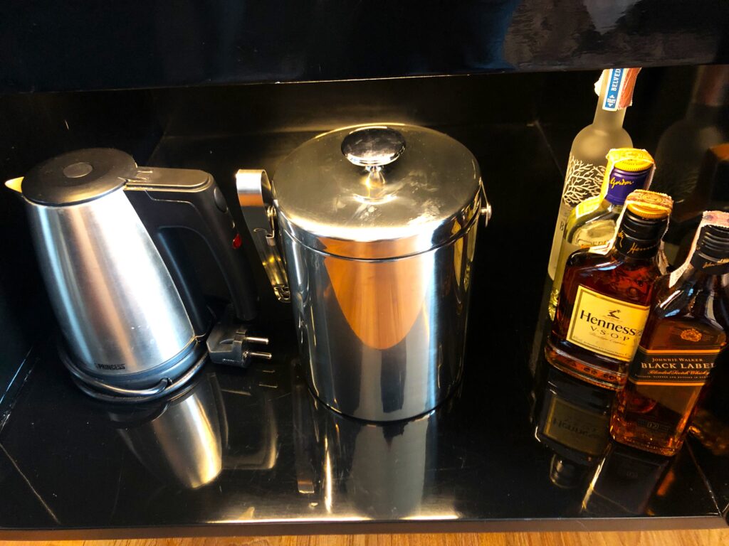a coffee pot and other beverages on a counter