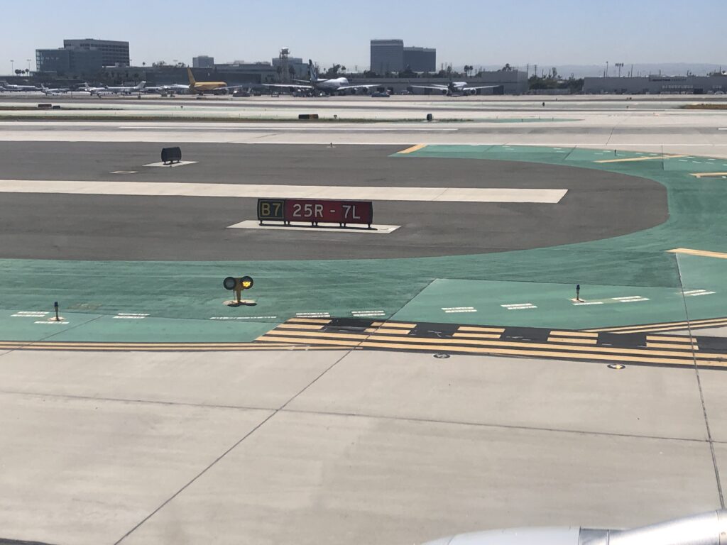 a runway with a sign on it