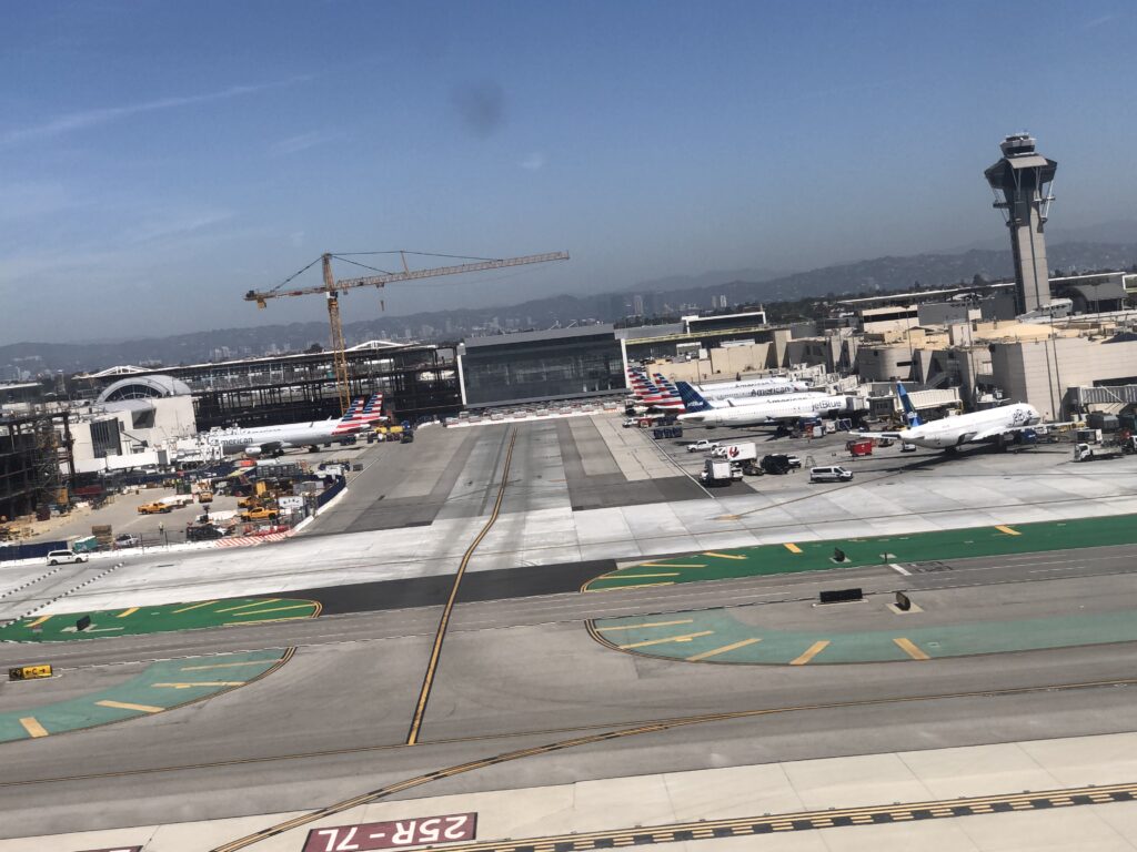 an airport with airplanes on the runway