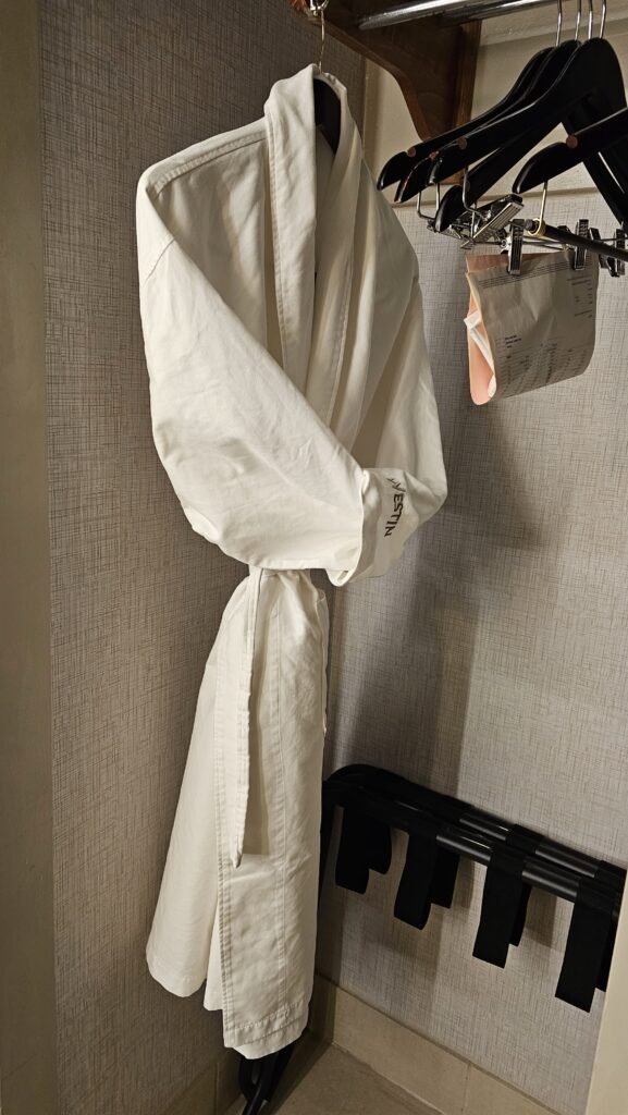 a white robe on a hook