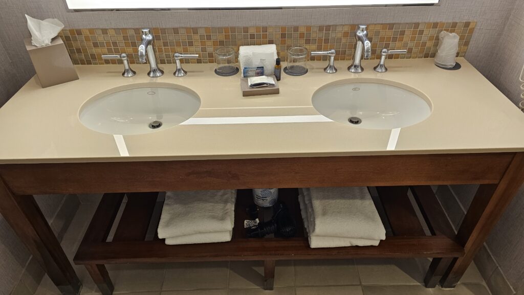 a bathroom sink with a shelf