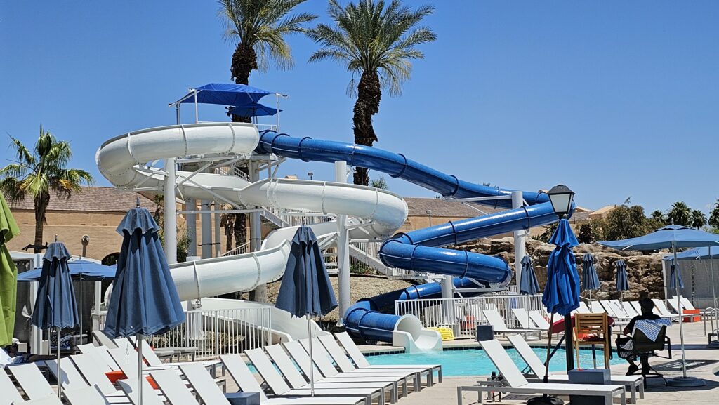 a water slide next to a pool