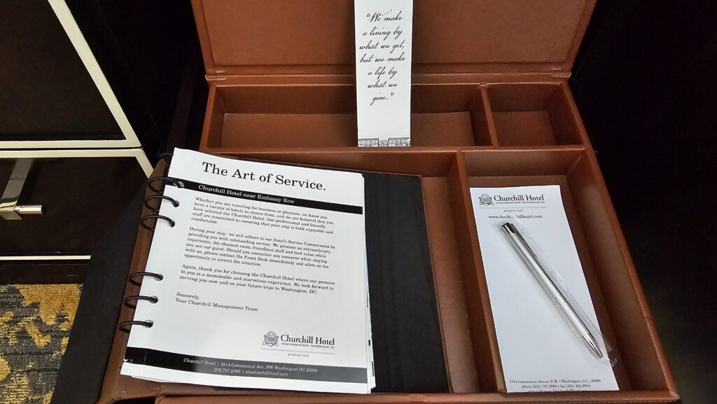 a box with a pen and a book in it