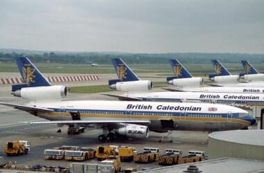 a group of airplanes at an airport