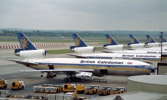 a group of airplanes at an airport