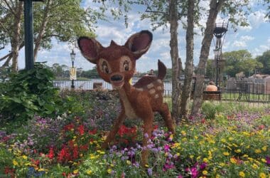 a statue of a deer in a garden