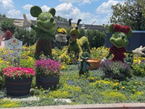 a group of cartoon characters in a garden