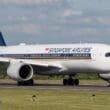 a large white airplane on a runway