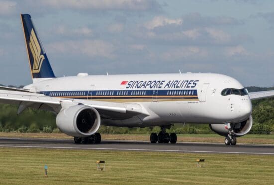 a large white airplane on a runway