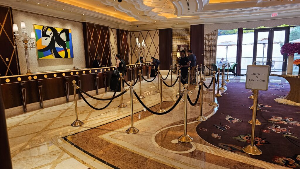a hotel reception with rope barriers
