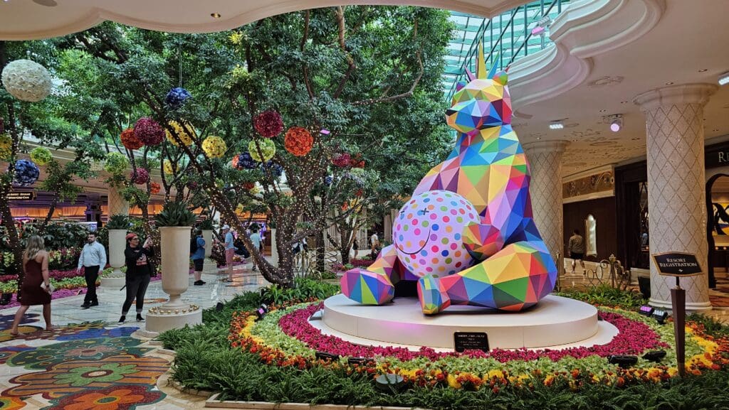 a colorful statue of a cat in a mall