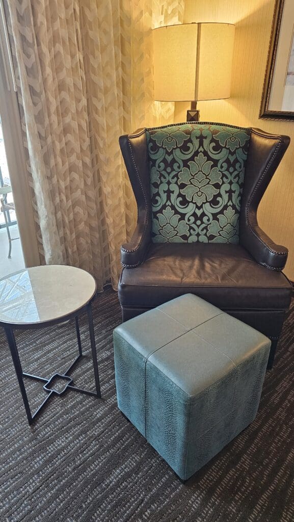 a chair and ottoman in a room